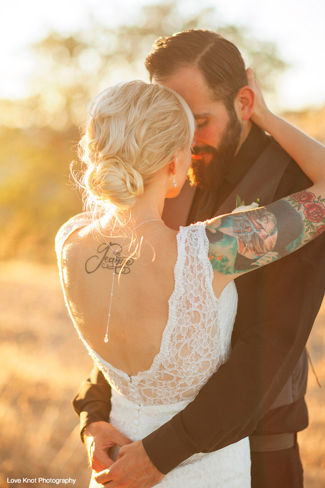 bride and groom at sunset sharing a quiet moment