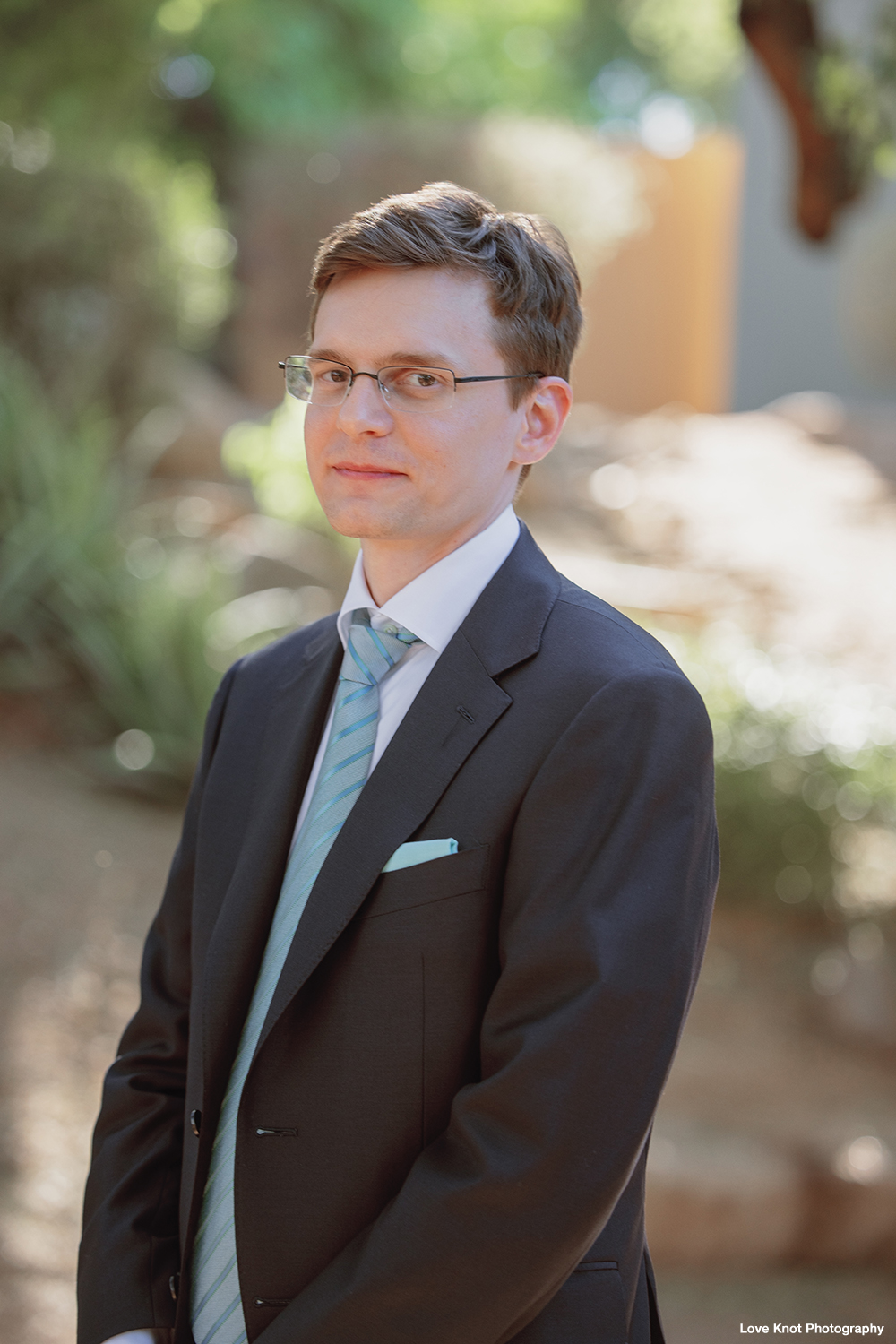 wedding portrait of groom ready for first look